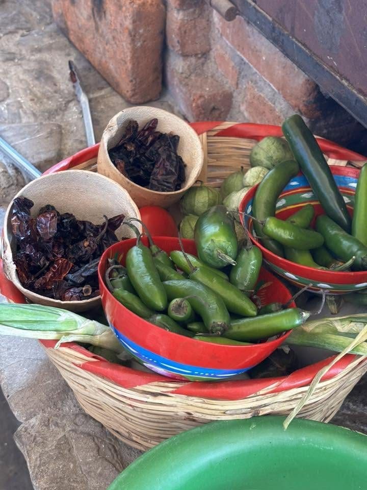 Woven basket of dried and fresh chiles at a market in Oaxaca, Mexico